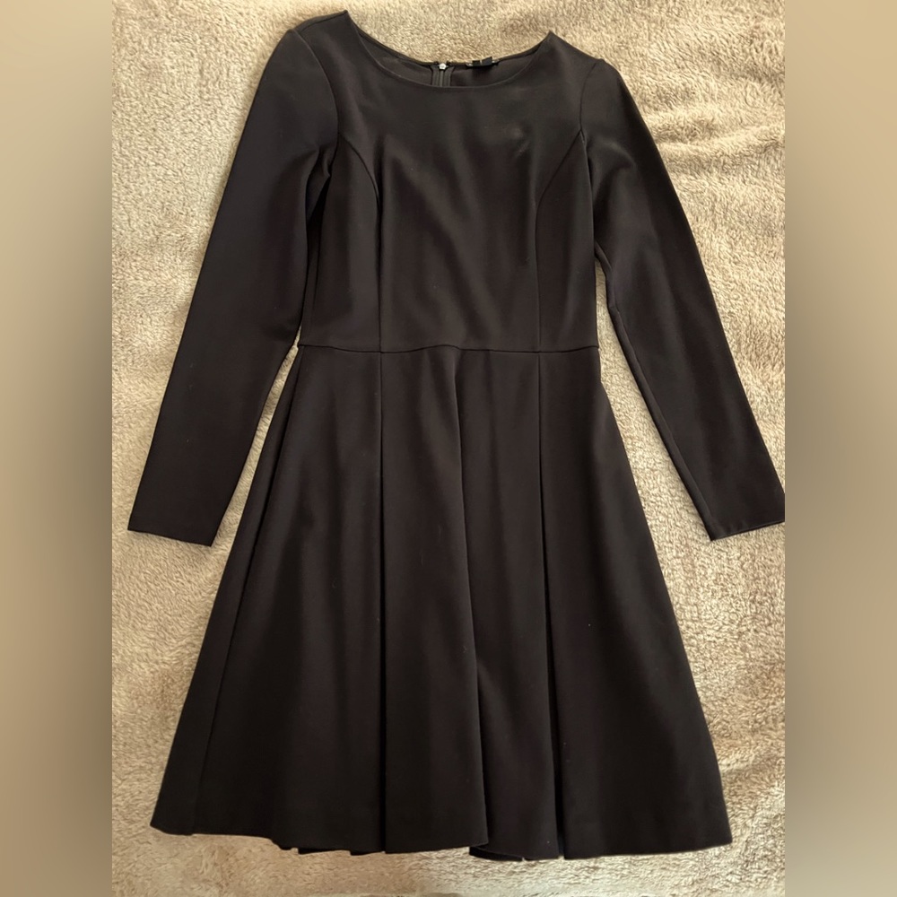Black lined knee length dress. Like new.